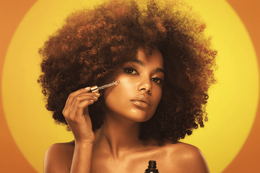 lady putting on facial oil