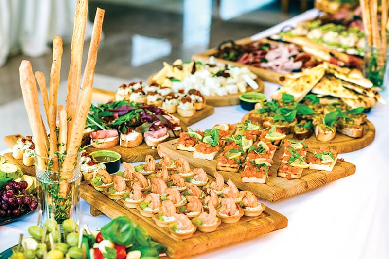 Snacks set. Wooden boards plates with different delicious snacks. Appetizers table with Italian antipasti snacks. Authentic traditional Spanish tapas set.